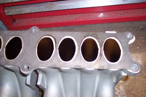 1995 Ford Bronco - Engine intake manifold shown with six intake ports visible.