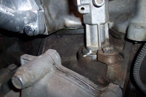 1995 Ford Bronco - This image shows a detailed view of engine components, including metal housings and fasteners.