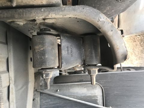 1997 Dodge 3500 - Close-up view of the rear suspension system on a truck, showing the mounting hardware and bushings.
