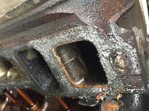 1996 Ford Bronco - Close-up of a heavily used engine intake manifold, indicating wear and potential issues.