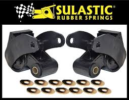 1997 Dodge 3500 - A pair of Sulastic Rubber Springs rear suspension components and washers are displayed against a black background.