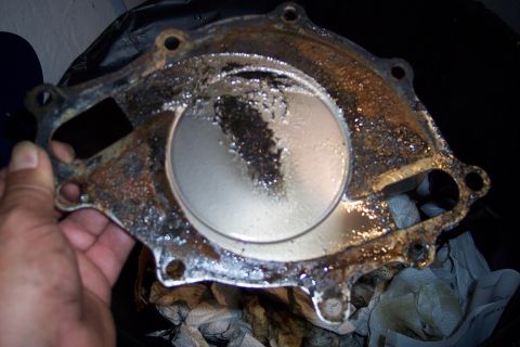 1995 Ford Bronco - Close-up of a heavily corroded water pump housing, likely needing replacement.