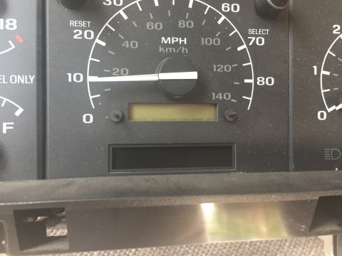 1996 Ford Bronco - Dashboard gauges, including a speedometer and fuel indicator, are shown in this close-up view.