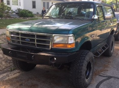 1996 Ford Bronco - This 1996 Ford Bronco is shown from the front-three-quarter view with a custom bumper and off-road tires.