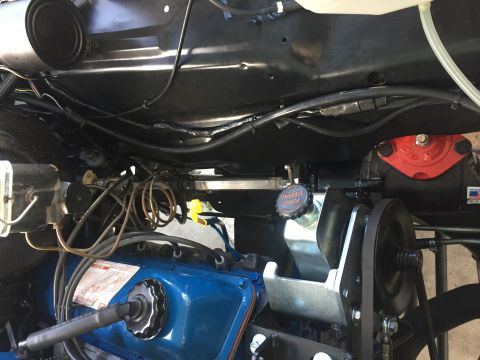 1978 Ford Bronco - Close-up view of an engine bay, focusing on the power steering system and engine components.