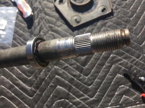 1978 Ford Bronco - Close-up view of a splined shaft with a bearing, possibly a component from a vehicle's engine bay.
