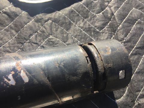 1978 Ford Bronco - Detail of a worn metal shaft, likely a vehicle steering or driveshaft component.