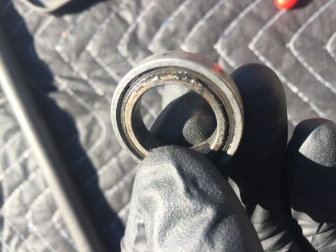 1978 Ford Bronco - Close-up of a damaged wheel bearing, likely needing replacement.