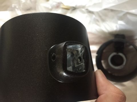 1978 Ford Bronco - Black steering column shroud with a damaged mounting bracket shown in detail.