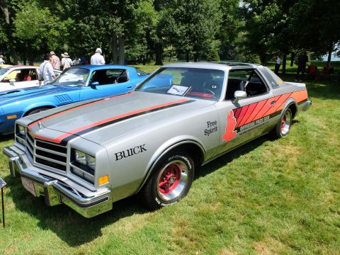 1971 Ford Ranchero - Silver 1978 Buick Regal "Free Spirit" Official Pace Car with distinctive graphics is displayed at an outdoor car show.