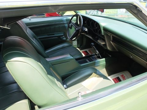 1971 Ford Ranchero - Interior view of a 1971 Ford Ranchero, green upholstery and dashboard details.
