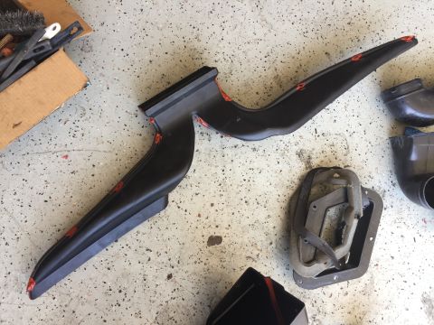 1978 Ford Bronco - Automotive HVAC components are laid out on a speckled concrete floor, possibly for repair or replacement.