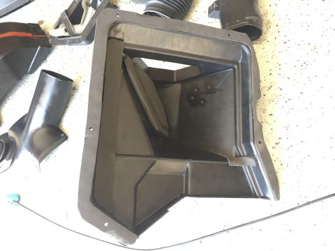 1978 Ford Bronco - This image shows a collection of HVAC ducting components, including a main housing and several connecting tubes and vents.