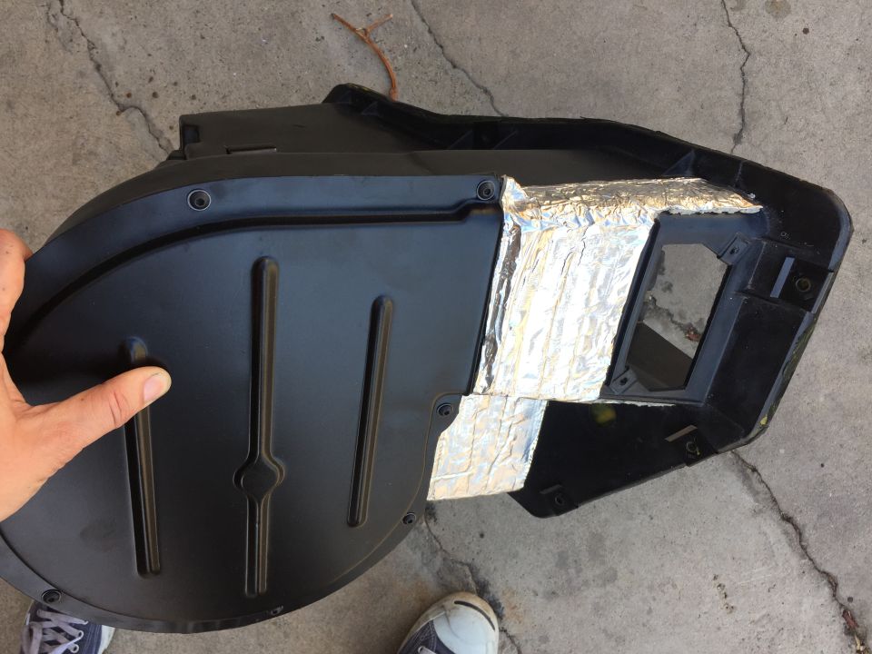 black plastic HVAC ducting with silver insulation tape