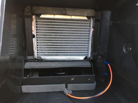 1978 Ford Bronco - Close-up of a vehicle's heater core and fan assembly, showing wiring and internal components.