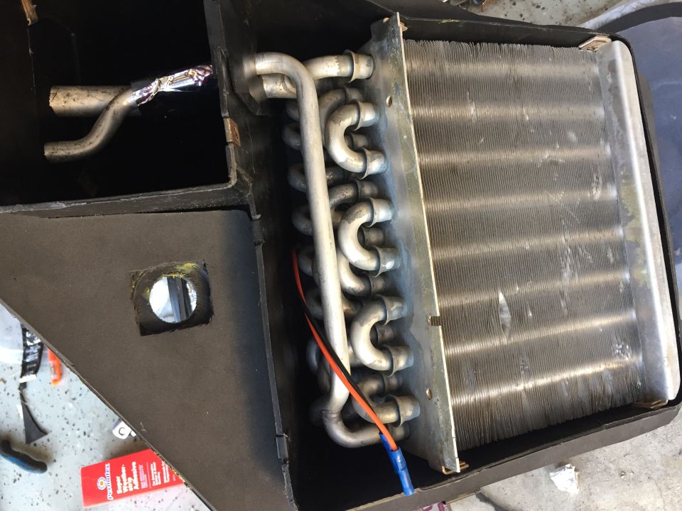 HVAC evaporator core with bent fins and metal tubing