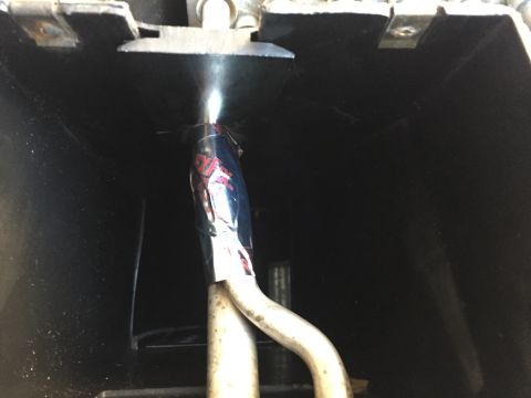 1978 Ford Bronco - Close-up of automotive AC ducting with visible tape and pipes.