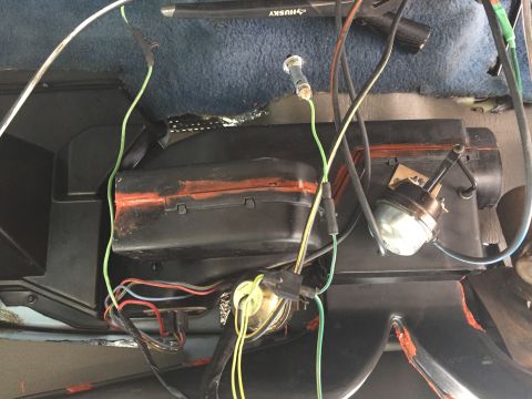 1978 Ford Bronco - This image shows a complex wiring harness and parts of the HVAC system within a vehicle's interior.