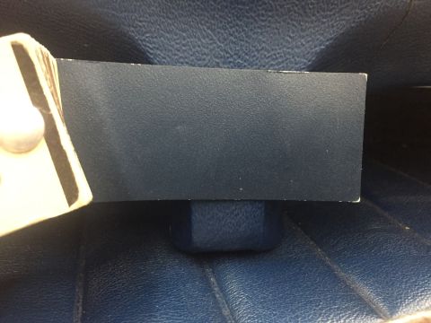 1978 Ford Bronco - Close-up of a dark blue textured panel, possibly from a vehicle interior.