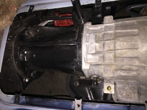 1978 Ford Bronco - Underside view of the transmission and associated drivetrain parts, showing mechanical details.