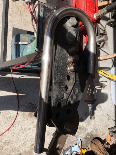 1992 Jeep Wrangler - A custom metal fabrication part with visible text and hardware is bolted to a larger assembly.
