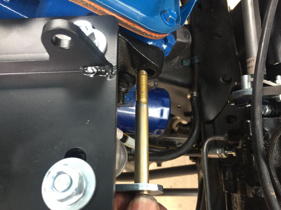 Engine part with bolt and blue oil filter