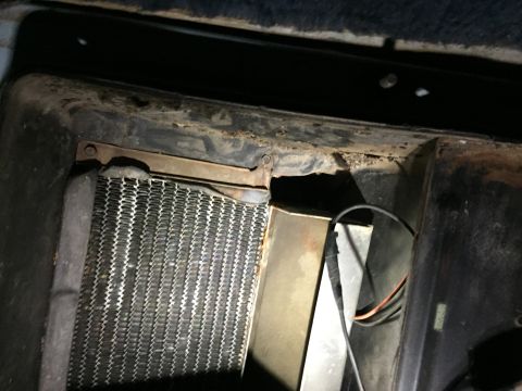 1978 Ford Bronco - Close-up of a vehicle's heater core and surrounding components.
