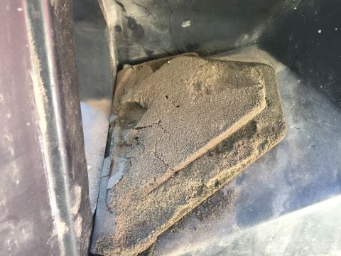 1978 Ford Bronco - Close-up of aged, dusty foam insulation within a vehicle's interior or engine bay.