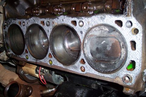 1995 Ford Bronco - Close-up of an engine block's cylinders, indicating internal engine work or wear.