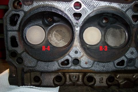 1995 Ford Bronco - Close-up view of an engine cylinder head, showing intake and exhaust valves and combustion chambers.