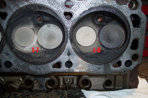 1995 Ford Bronco - Close-up of an engine cylinder head showing two combustion chambers and valves.
