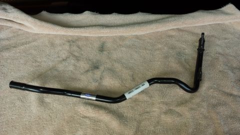 2005 Mercury Grand Marquis - A black metal automotive part with part numbers visible is displayed on a cloth surface.