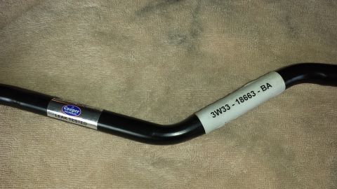 2005 Mercury Grand Marquis - A black automotive part, possibly a sway bar, with 'Cooper Standard' and part number '3W33-18663-BA' visible on labels.