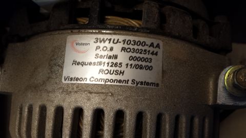 2005 Mercury Grand Marquis - Close-up of an alternator with a Visteon label indicating it is a ROUSH component.