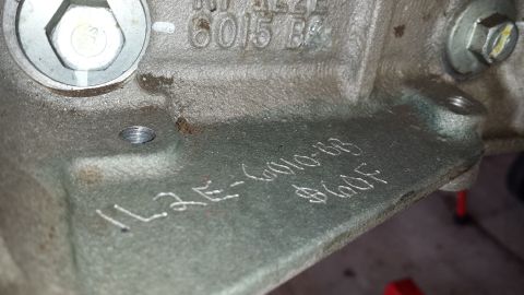 2005 Mercury Grand Marquis - Close-up of an engine component showing stamped identification numbers and codes.