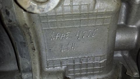 2005 Mercury Grand Marquis - Close-up of an engine component showing stamped casting numbers XARE 4775 and LH.