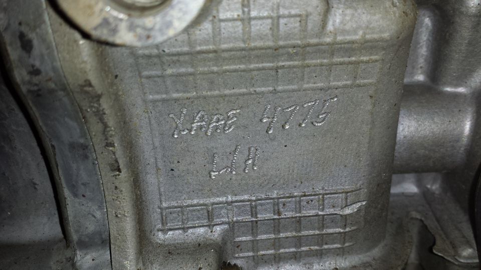 Engine part with casting numbers XARE 4775 LH