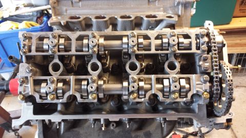 2005 Mercury Grand Marquis - Close-up view of an engine's cylinder head, detailing the camshafts and timing chain.