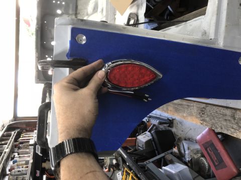 1992 Jeep Wrangler - Installing a new LED tail light assembly onto a vehicle's body panel.