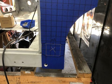 1992 Jeep Wrangler - Work in progress on a vehicle's interior, showing a metal panel covered in blue grid tape.