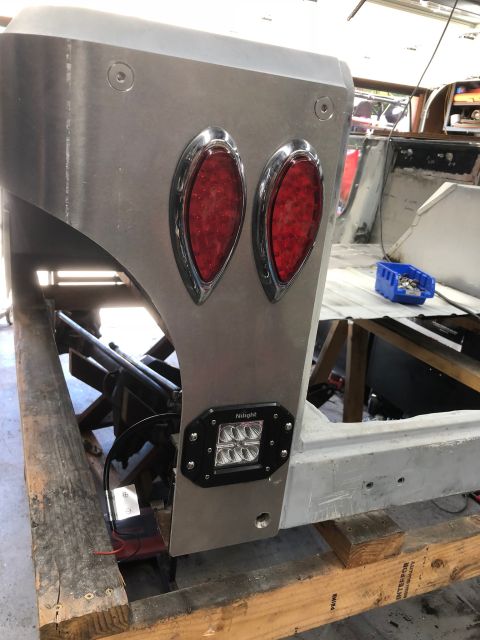 1992 Jeep Wrangler - Close-up of a vehicle's rear corner showing custom bodywork and lighting components.