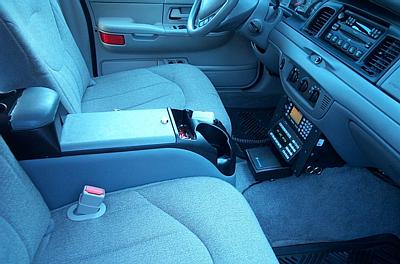 2001 Ford Crown Victoria - Interior view of a 2001 Ford Crown Victoria, equipped with a center console and radio equipment.