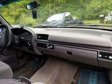 1996 Ford Bronco - Interior view of a 1996 Ford Bronco XLT, showing the dashboard and passenger side.