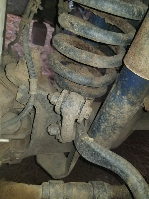 1996 Ford Bronco - Suspension components including a coil spring and shock absorber are visible in this close-up shot.