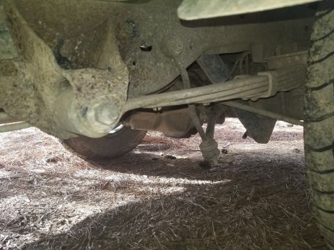 1996 Ford Bronco - The rear suspension of a 1996 Ford Bronco features prominent leaf springs and shocks.