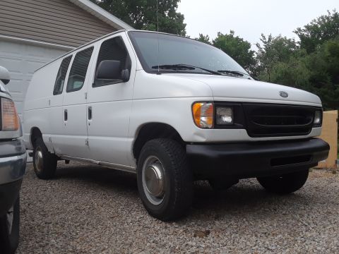 1999 Ford E250 - This 1999 Ford E250 cargo van is seen from a 3/4 front angle, driver's side angle.
