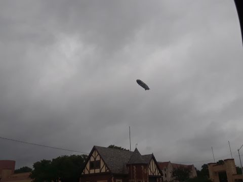 1994 Ford Bronco - A blimp is visible in the sky over a building with distinctive Tudor architecture.