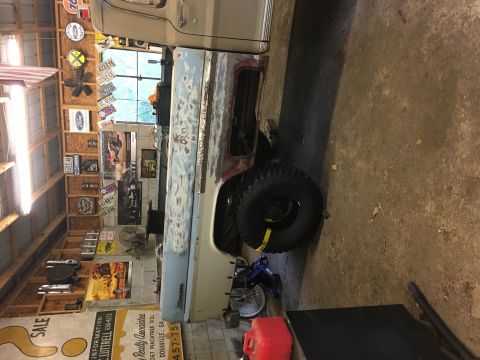 1967 Ford F-250 - This 1967 Ford F-250 truck is in a garage, showing its bodywork in progress.