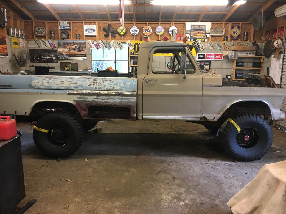 1967 Ford F-250 pickup truck, side view, undergoing restoration