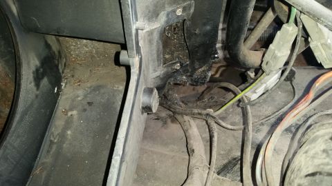 1985 Ford Bronco - Close-up view of the interior wiring harness and associated components, showing connectors and conduits.